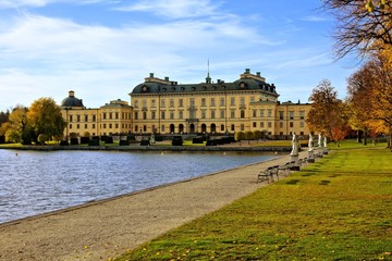 Obraz premium View of Drottningholm Palace, Sweden's royal residence with lake during autumn