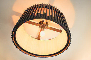 Large wooden lamp hanging at the ceiling.