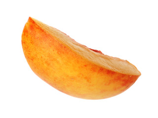 Slice of juicy peach on white background
