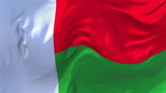 296. Madagascar Flag Waving in Wind Slow Motion Animation . 4K Realistic Fabric Texture Flag Smooth Blowing on a windy day Continuous Seamless Loop Background.