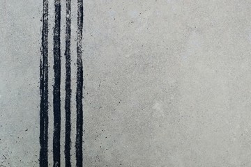 black tire track on dirty concrete after sudden brake
