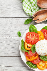Caprese salad with tomatoes, basil and mozzarella