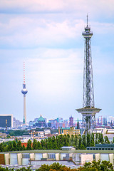 View over downtown Berlin with "Funkturm" (radio tower), "Fernsehturm" (TV tower), "Rotem Rathaus" (Red Townhall) and various other sights.