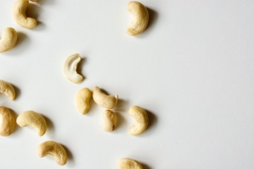 Tasty raw white cashew nuts on the white background