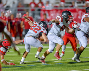 Football player running with the ball during a game