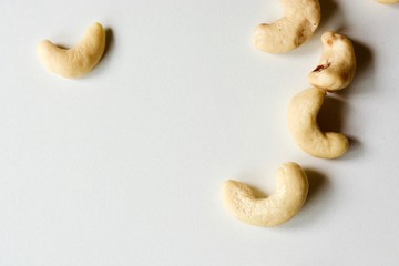 Tasty raw white cashew nuts on the white background