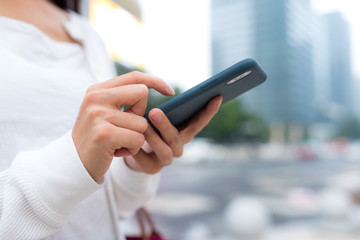 Woman using cellphone at outdoor