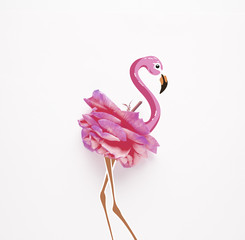 Pretty in pink / Creative concept photo of rose flower with illustrated flamingo bird.