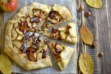 Homemade galette with apples plums and nuts