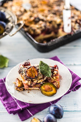 The traditional sweet plum cake on white plate