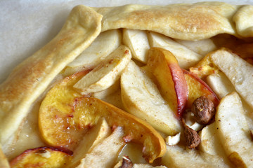 Homemade galette with different fruits with pears, peaches and nuts