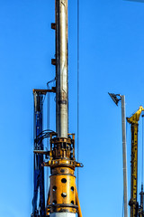 construction site with cranes against the blue sky
