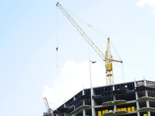 Construction site with crane and building.