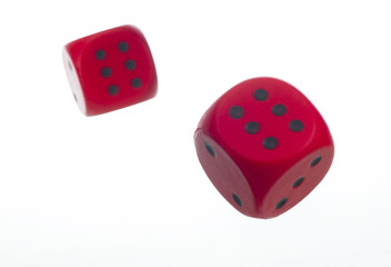 Two red dice isolated on white background. Gaming dice. Close-up. 