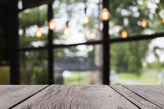 Old Wooden Table On Front With Blurred Restaurent Background, For Persentation Object