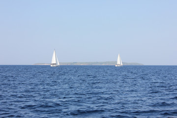 Sailboat In Blue Water