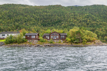 Fototapeta na wymiar Norwegian fjords and mountains seen from the sea
