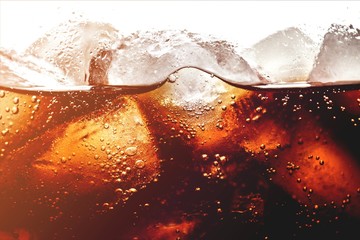Ice cubes in cola beverage, close up - obrazy, fototapety, plakaty