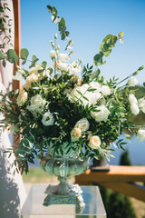 Arch for the wedding ceremony. Arch, decorated with beautiful fresh flowers and cloth.  Registration at the place of marriage. Wedding arch of real flowers. Night