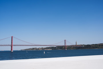 Tejo river with the 25th of April brigde and a yatch