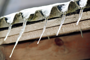 Icicle under the roof © NataliyaF