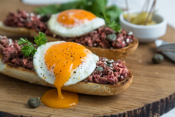 Beef tartare with pickled fried egg on top.