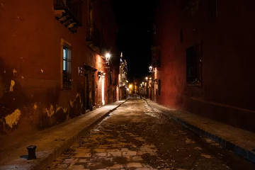 Fotobehang Street at nigh in San Miguel © J A Nicoli