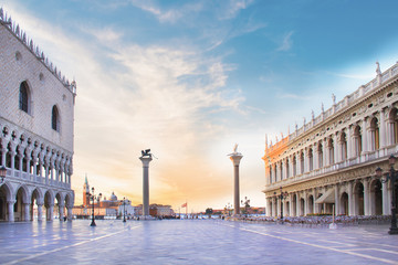 Beautiful view of the Doge's Palace, the Marcian Library, the column of Saint Mark and the column...