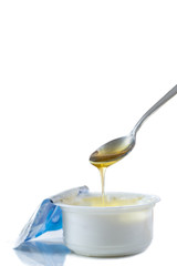 Honey Yogurt. Greek yogurt with honey in a pot with honey product