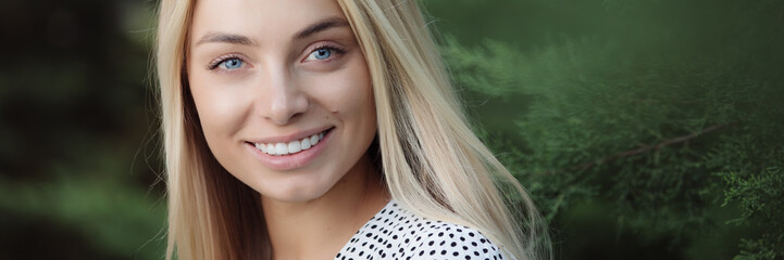 Smiling nice woman face. White teeth. Banner panorama.
