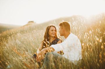 Happy in love couple having fun outdoor in nature at sunset, smiling girl, engagement © Vulp