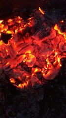Fototapeta premium Still not cooled coals after the morning bonfire