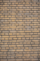 Wall from yellow bricks background texture abstract