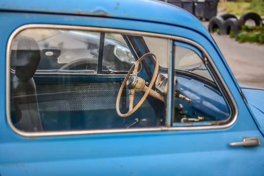 Side part of bright blue old automobile
