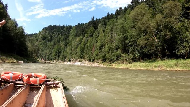 Driving on a traditional Polish raft.
The wooden boat floats on the river Danube.