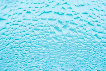 Glass with transparent water rain drops patterns. Sweated surface of cool beverage drink. Freshness hydration purity concept. Abstract backdrop.
