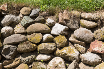 Fototapeta na wymiar Old round stone wall