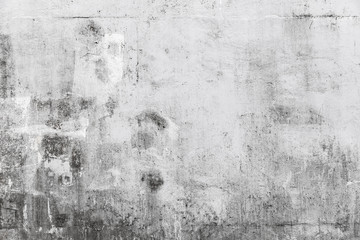 Grungy concrete wall with white paint brush strokes