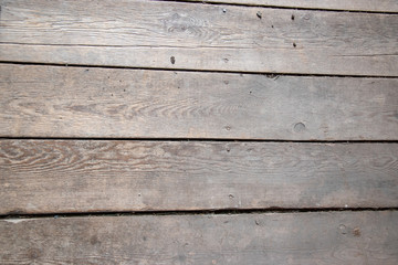 Obraz na płótnie Canvas Worn floor boards in an old barn
