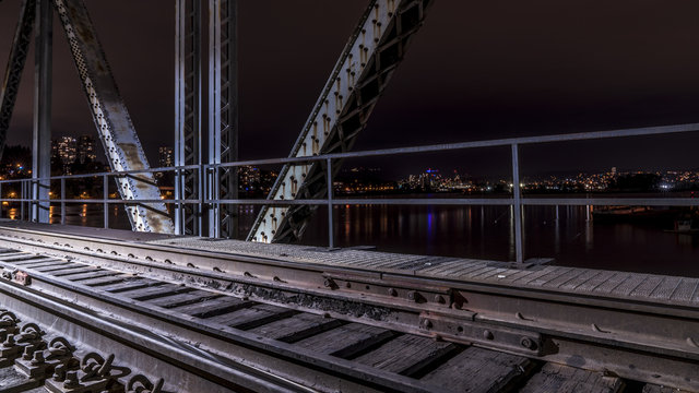 Patullo Bridge, Surrey, British Columbia, Canada. Long exposure of the bridge over the water. Sky Train Bridge.