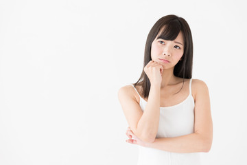 attractive asian woman thinking on white background