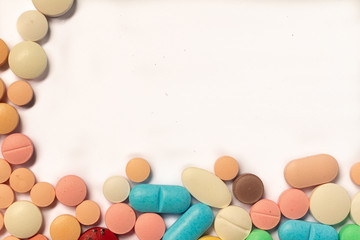 Drugs in the form of pills and colored tablets.