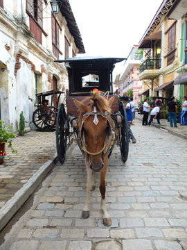 VIGAN, PHILIPPINES - JULY 25, 2015 : A Kalesa (or Horse Carriage) in Historic Town of Vigan..Vigan is a UNESCO World Heritage Site in that it is one of the few Spanish colonial town.