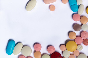 Drugs in the form of pills and colored tablets.