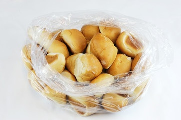 fresh baked bread rolls in the plastic bag
