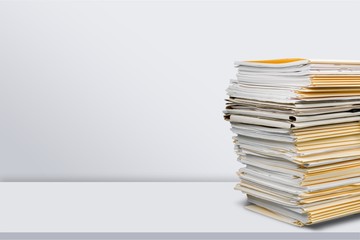 File folders with documents isolated on white background