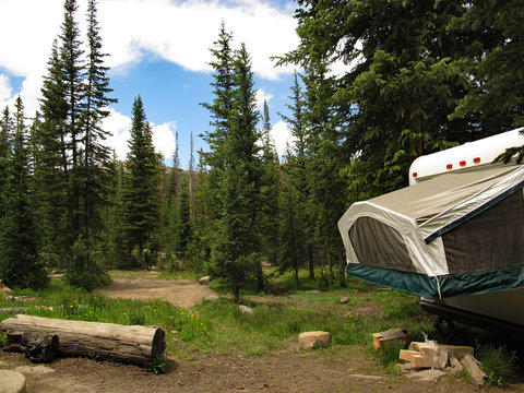 View Of Mountain Camping Site Around Tent Trailer