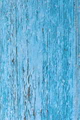 blue faded cracked paint texture. weathered peeled wooden surface