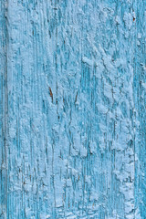 Fototapeta na wymiar wooden painted blue rustic background with cracks. paint peeling off