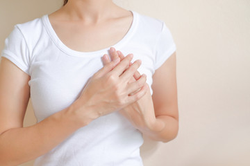 Woman suffering from chest pain on white background, Healthcare concept.